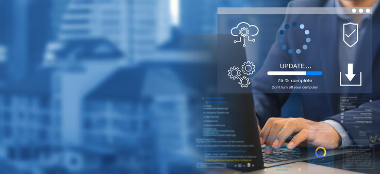 DSC_0604.1.5.3 A business person updates software, installs an update process, and upgrades the software version concept. Software updates or operating system upgrades