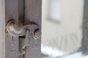 old window closing in a historic tenement house. window hasp.