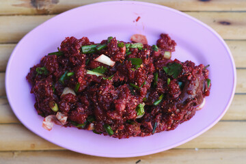 Thai beef salad on a plate on the table