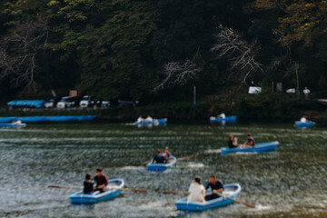 Arashiyama district panorama in western Kyoto, Japan, with boats and mountain Arashi, Togetsukyo bridge, Katsura Hozu River, autumn fall landscape view, travel to Japan, Kansai region, Kyoto