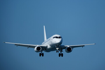 Airplane in the blue sky. Plane ready to land at the airport