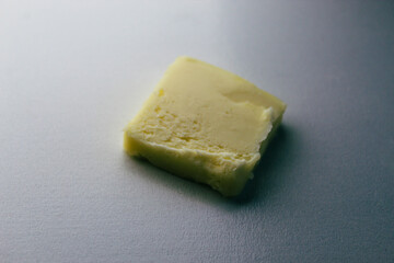 close-up of a pat of butter isolated on a white background
