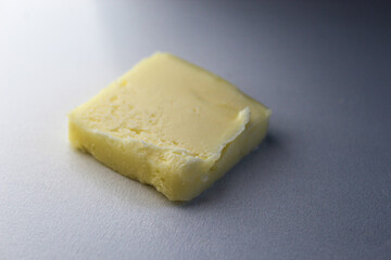 a pat of butter isolated on a white background