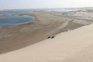 Beautiful landscape with dunes, sea and extreme sports
