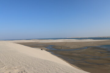 Sand dunes, sea and blue sky - Inland Sea, Qatar