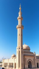 Magnificent Mosque Architecture with Tall Minaret Against a Clear Blue Sky