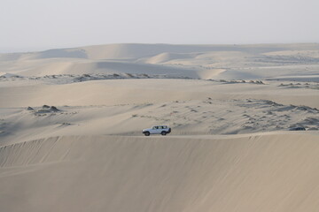 Inland Sea dune with an 4x4 car in the background