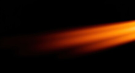 Abstract glowing orange light emanates across a dark backdrop, creating a dynamic visual effect.