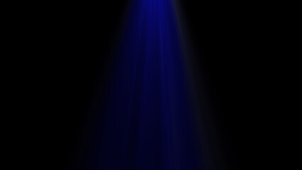 A single blue spotlight shines brightly from the top onto a studio stage, casting a cool and dramatic glow against the black background