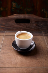 Cup of coffee on wooden background. Soft focus. Copy space.