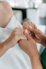 Baby holding mother's finger close-up photo. Parental support