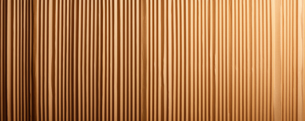 Obraz premium Textured corrugated cardboard with vertical stripes in kraft brown color, creating warm and natural aesthetic. Ideal for backgrounds or design projects