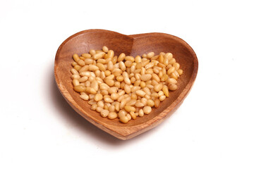 heart shaped bowl with pine nuts
