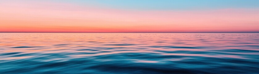 Obraz premium Serene Ocean Sunset with Soft Waves and Vibrant Colors Reflecting on Calm Water Surface