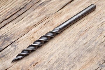 Auger Drill Bit Close Up on Weathered Wooden Plank Surface with Natural Light