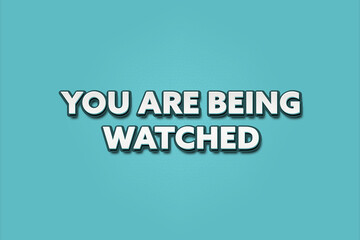 Fototapeta premium You are being watched.. A Illustration with white text isolated on light green background.