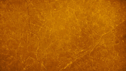 image presenting a close-up view of a slab or tile of gold marble, showcasing its natural veining patterns and smooth, yellow polished surface, suitable for use as a background design projects.
