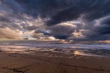 A stormy Mediterranean Sea sunset on  the coastline near Haifa, Israel. 
