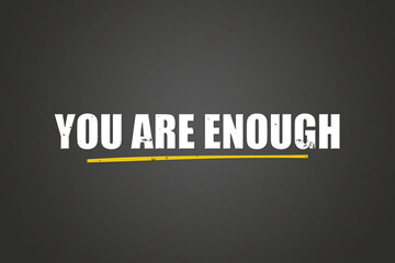 You are enough. A blackboard with white text. Illustration with grunge text style.