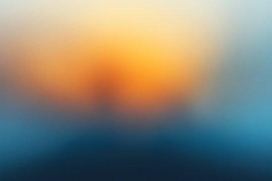 A blurry photo of a sunset with a blue and orange sky.  Abstract gradient background, with orange and navy blue hues, a grainy film texture