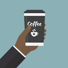 Businessman hand holding a reusable mug. Thermo cup or tumblers with cover for take away hot coffee or tea. Coffee to go. Break, time for coffee.