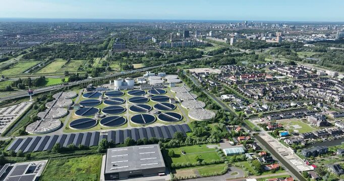 wastewater or sewage treatment plant water purification, sludge processing and heat and energy generation. Aerial drone view.