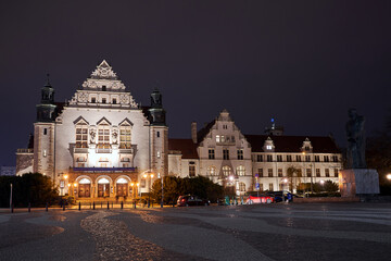 Fototapeta premium Neorenaissance facade of the building of the university auditorium at night in Poznan