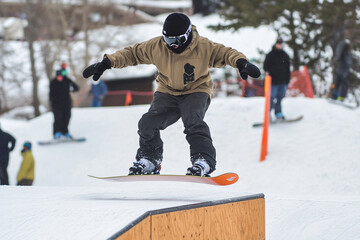 Thrilling Snowboarding Action on a Snowy Mountain Slope