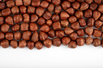 A group of peeled hazelnuts, isolated on a white background