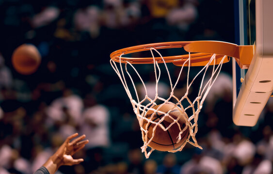 A basketball swishes through the net in a thrilling moment of competitive basketball action