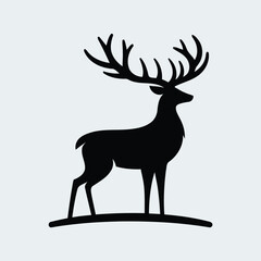 Majestic Standing Stag Silhouette with Large Antlers on a Hill