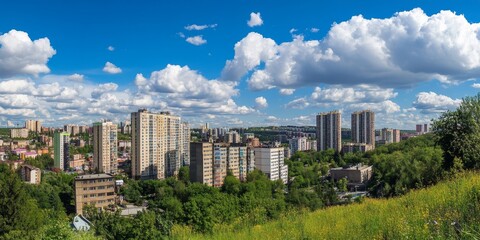 Fototapeta premium Vibrant City Skyline Under a Blue Sky With Fluffy Clouds, Showcasing Modern Architecture and Lush Greenery in a Dynamic Urban Environment