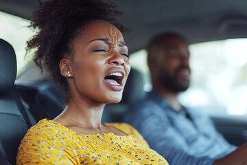 Black pregnant woman shouting, feeling pain and contractions while her worried husband driving car and looking at wife