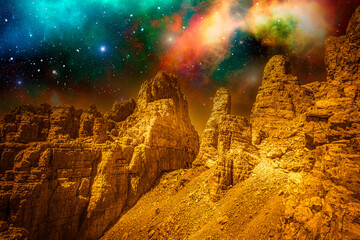 Alien golden landscape, with surface of another planet with rocks and sky full of stars. Photo montage that recreates an alien landscape of an extraterrestrial planet