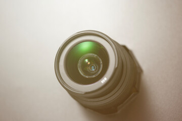 A camera lens with a green circle in the center.