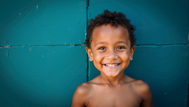 Young Boy Smiling Joyfully for a Picture Moment