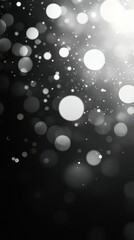 Abstract black and white background featuring blurred circles of light with a soft bokeh effect