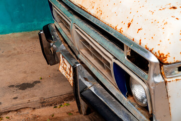 Front view of an old truck with a rusty license plate. South America. Old cars.