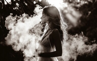 Obraz premium Woman vaping in a misty forest with sun rays filtering through trees during golden hour
