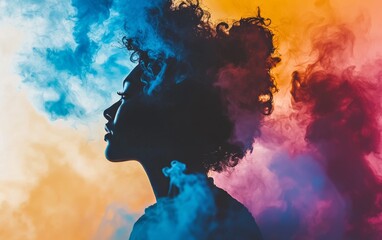 Vibrant silhouette of a woman surrounded by colorful smoke in a creative art setting