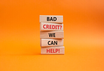 Bad credit We can Help symbol. Wooden blocks with words Bad credit We can Help. Beautiful orange background. Business and Bad credit We can Help concept. Copy space.