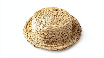 A stylish straw hat rests on a clean white surface, set against a minimalist white background, highlighting its texture and design.