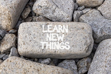 Learn new things symbol. Concept words Learn new things on beautiful grey stone. Beautiful grey stones background. Business motivational learn new things concept. Copy space.