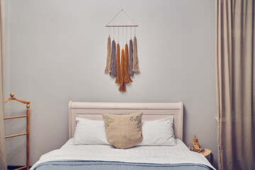 Bedroom with a bed, modern interior. A room with a copy space, a place for your design, drawing, poster. High quality photo