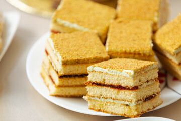 Honey cake sliced for serving portions. Unhealthy lunch for sugar addict people.