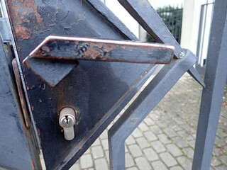 metal door handle of an iron gate