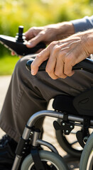Obraz premium Close-up of elderly hands operating a joystick on a mobility scooter, highlighting accessibility and independence for seniors.