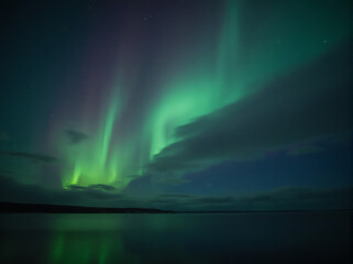 Naklejka premium Aurora Borealis Over Calm Water