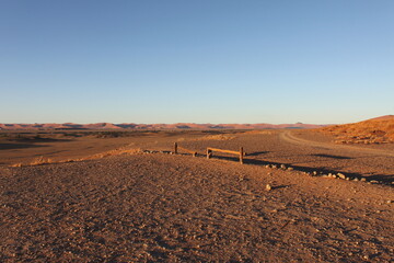 Morning atmosphere in Namib Desert shortly after sunrise with long shadows and golden light....