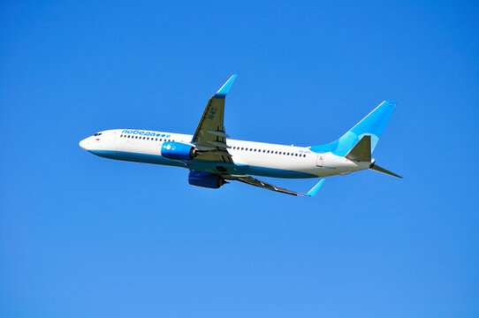 ST PETERSBURG RUSSIA - MAY 11, 2016. Pobeda Airlines Boeing 737 Next Gen airplane is flying above after departure from Pulkovo International airport in Saint-Petersburg, Russia